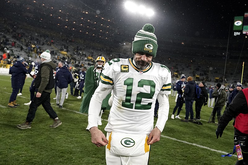 Green Bay Packers quarterback Aaron Rodgers (12) walks off the field after the team's NFL football game against the Tennessee Titans Thursday, Nov. 17, 2022, in Green Bay, Wis. (AP Photo/Morry Gash)