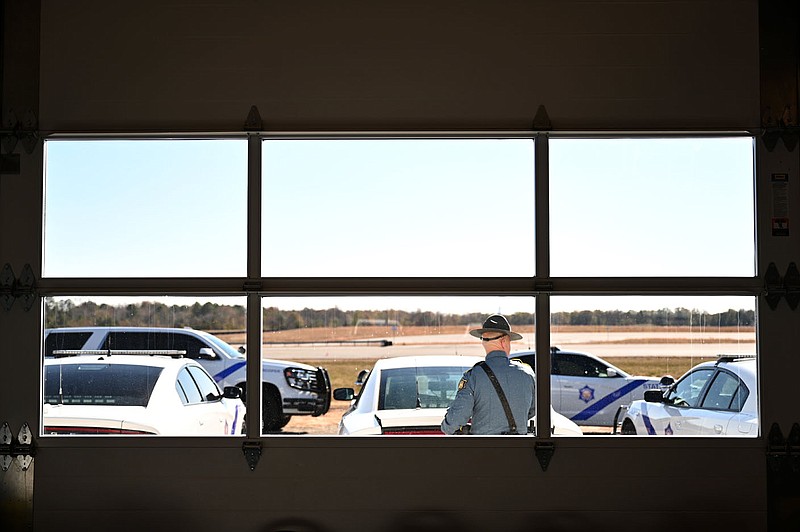 A State Trooper parks his car outside the new control tower-garage building near the Arkansas State Police's new precision driving training track at Camp Robinson before the start a ribbon cutting ceremony on Thursday, Nov. 17. (Arkansas Democrat-Gazette/Stephen Swofford)