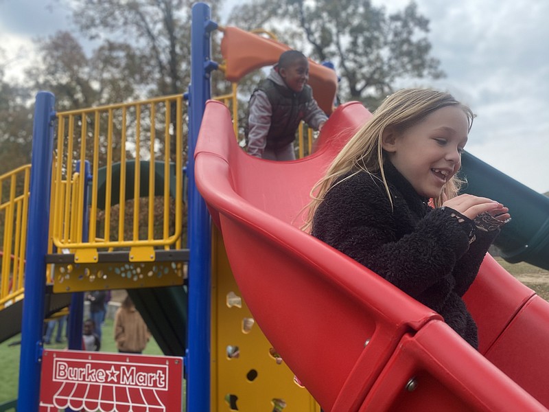 Ashdown Elementary students go down a slide Friday, Nov. 18, 2022, at the new inclusive playground at Ashdown City Park. (Staff photo by Andrew Bell)