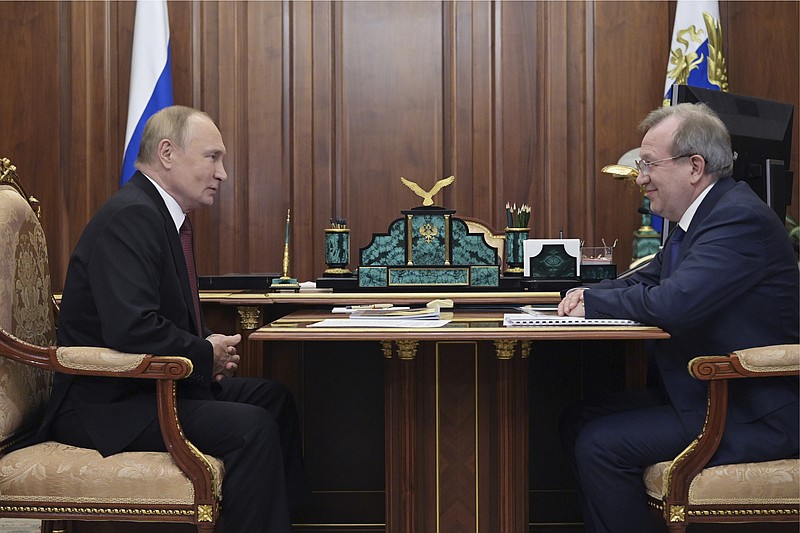 FILE - Russian President Vladimir Putin, left, meets with the President of the Russian Academy of Sciences Gennady Krasnikov at the Kremlin in Moscow, Russia, Nov. 11, 2022. As Russia faces mounting setbacks in Ukraine, Putin appears to have delegated delivering unpopular news to others — a tactic he has already used during the coronavirus pandemic. (Aleksey Babushkin, Sputnik, Kremlin Pool Photo via AP, File)