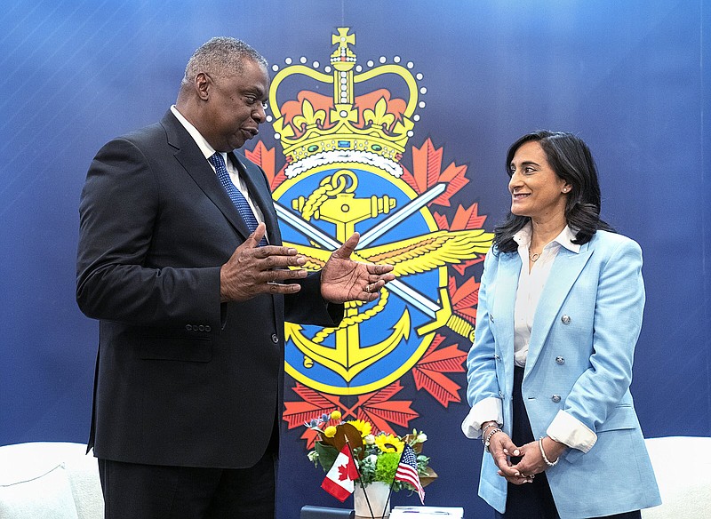 Canadian Defence Minister Anita Anand, right, and U.S. Secretary of Defense Lloyd J. Austin III hold a bilateral meeting at the Halifax International Security Forum in Halifax on Saturday, Nov.19, 2022. (Andrew Vaughan /The Canadian Press via AP)