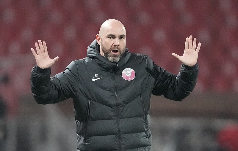 FILE - Qatar's coach Felix Sanchez reacts during the international friendly soccer match between Serbia and Qatar, at the Rajko Mitic stadium in Belgrade, Serbia, Thursday, Nov. 11, 2021. (AP Photo/Darko Vojinovic, File)