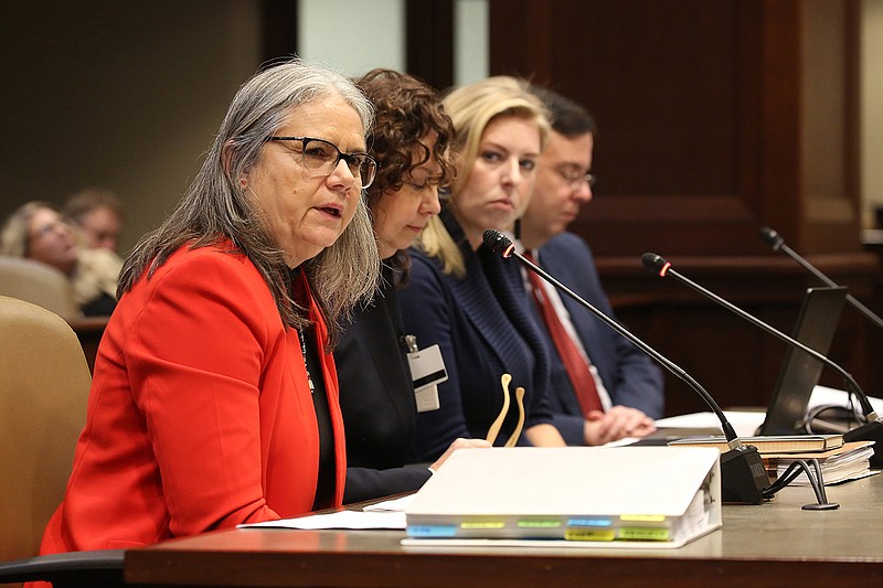 Patricia Gann (from left), Paula Stone and Melissa Weatherton with the Arkansas Department of Human Services discuss the report of a study on mental and behavioral health during the joint meeting of the Health Services subcommittee on Monday, Nov. 14, 2022, at the state Capitol in Little Rock. 
(Arkansas Democrat-Gazette/Thomas Metthe)