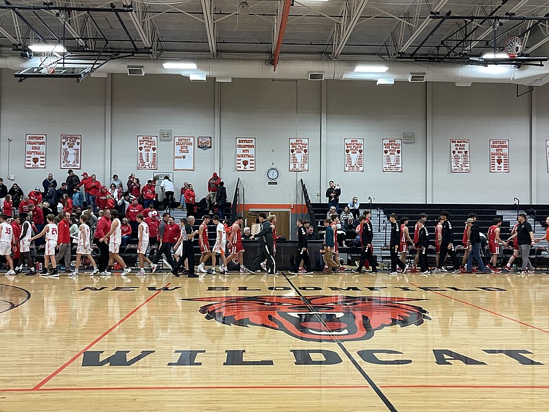 New Bloomfield boys basketball's and Harrisburg's players shake hands after the Saturday afternoon game at New Bloomfield's basketball court in New Bloomfield. (Fulton Sun/Robby Campbell)