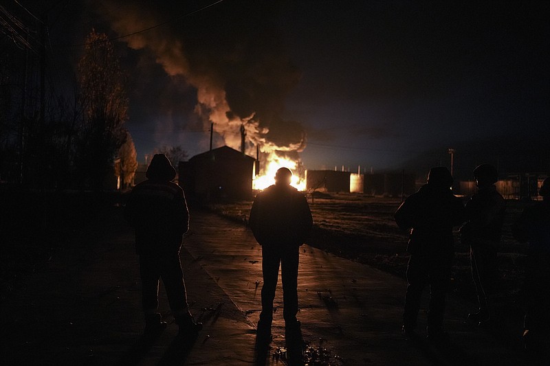 A plume of smoke rises during a fire caused by a Russian airstrike in Kherson, southern Ukraine, Saturday, Nov. 19, 2022. (AP Photo/Roman Hrytsyna)