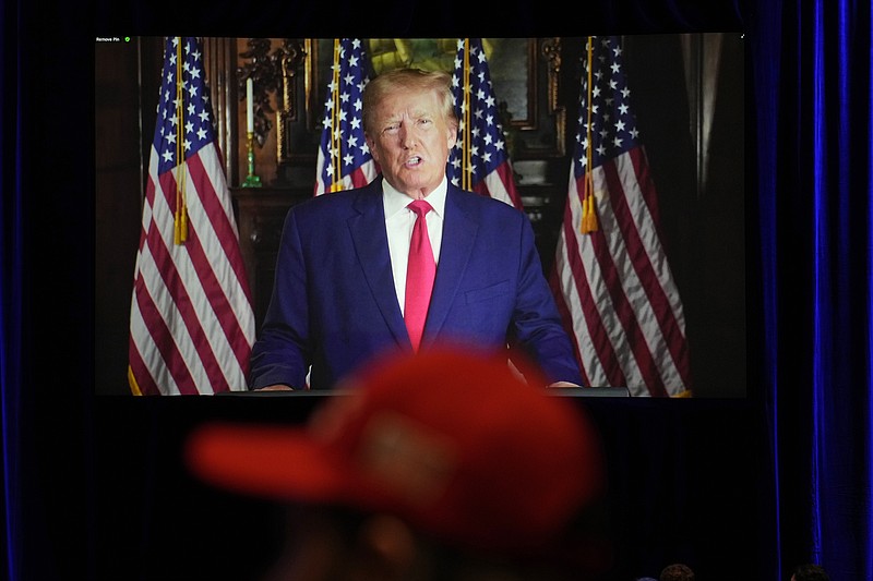 FILE - People listen as former President Donald Trump speaks remotely to an annual leadership meeting of the Republican Jewish Coalition, Nov. 19, 2022, in Las Vegas. (AP Photo/John Locher, File)