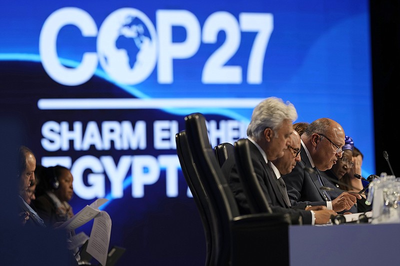 Sameh Shoukry, president of the COP27 climate summit, right, speaks during a closing plenary session at the U.N. Climate Summit, Sunday, Nov. 20, 2022, in Sharm el-Sheikh, Egypt. (AP Photo/Peter Dejong)