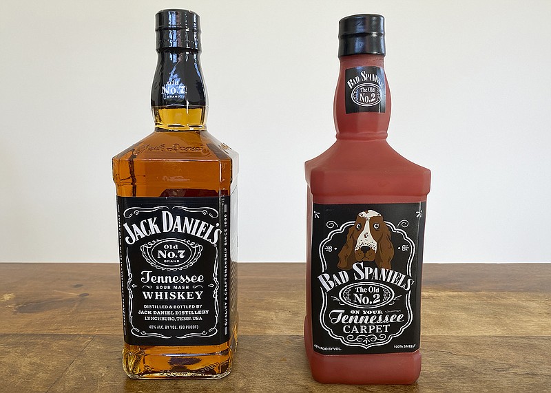 A bottle of Jack Daniel's Tennessee Whiskey is displayed next to a Bad Spaniels dog toy in Arlington, Va., Sunday, Nov. 20, 2022. Jack Daniel's has asked the Supreme Court justices to hear its case against the manufacturer of the toy. (AP Photo/Jessica Gresko)