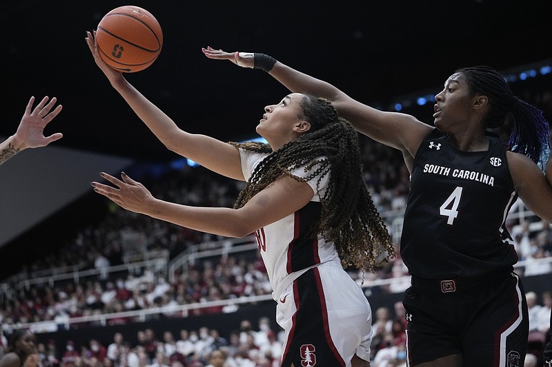 Stanford guard Haley Jones, left, shoots while defended by South Carolina forward Aliyah Boston (4) during the second half of an NCAA college basketball game in Stanford, Calif., Sunday, Nov. 20, 2022. (AP Photo/Godofredo A. Vásquez)
