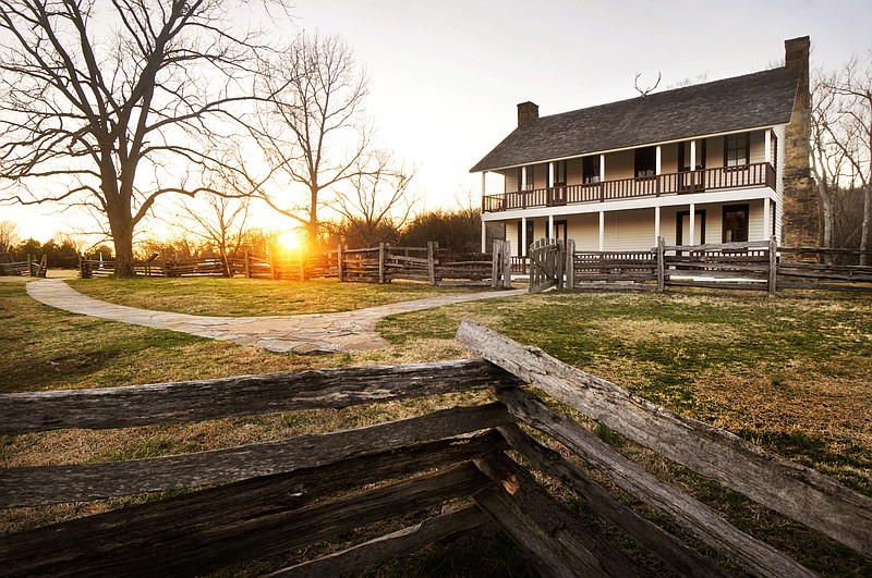 The sun sets behind Elkhorn Tavern on March 3, 2016, at Pea Ridge National Military Park near Garfield.
(File Photo/NWA Democrat-Gazette)