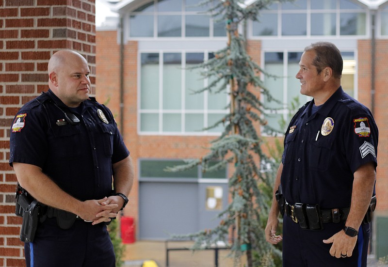 Liv Paggiarino/News Tribune

In this October 2020 file photo, Student Resource Officer Chris Gosche and Sgt. Joseph Matherne, the Student Resource Officer Supervisor, talk outside of Jefferson City High School. School Resource Officers are one way that the district can respond immediately to any situation that may arise, Director of Safety, Facilities and Transportation Frank Underwood said.