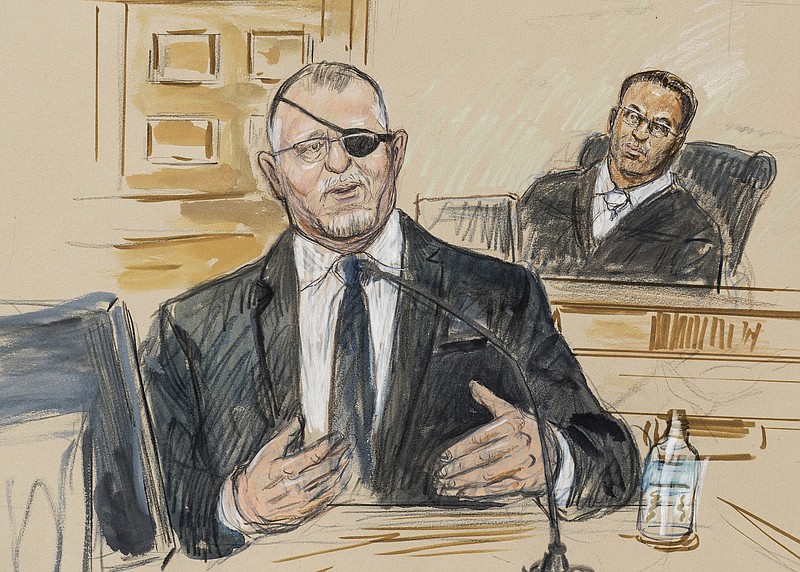 This artist sketch depicts the trial of Oath Keepers leader Stewart Rhodes, left, as he testifies before U.S. District Judge Amit Mehta on charges of seditious conspiracy in the Jan. 6, 2021, attack on the U.S. Capitol on Nov. 7, 2022, in Washington. Jury deliberations are expected to begin soon. (Dana Verkouteren via A, File)