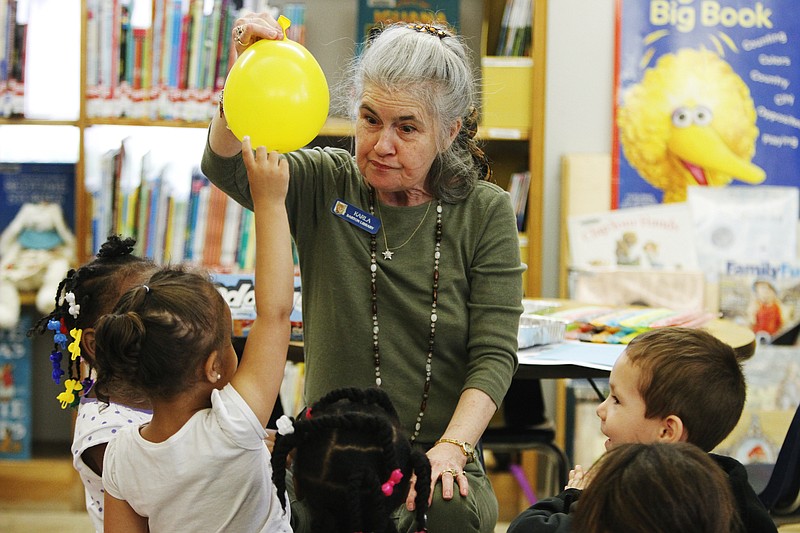 Karla Nelson teaches children the properties of matter during Storytime at the Barton Library in April 2016. The children's librarian was fired last week, and some local residents have started a petition for her reinstatement. (News-Times file)