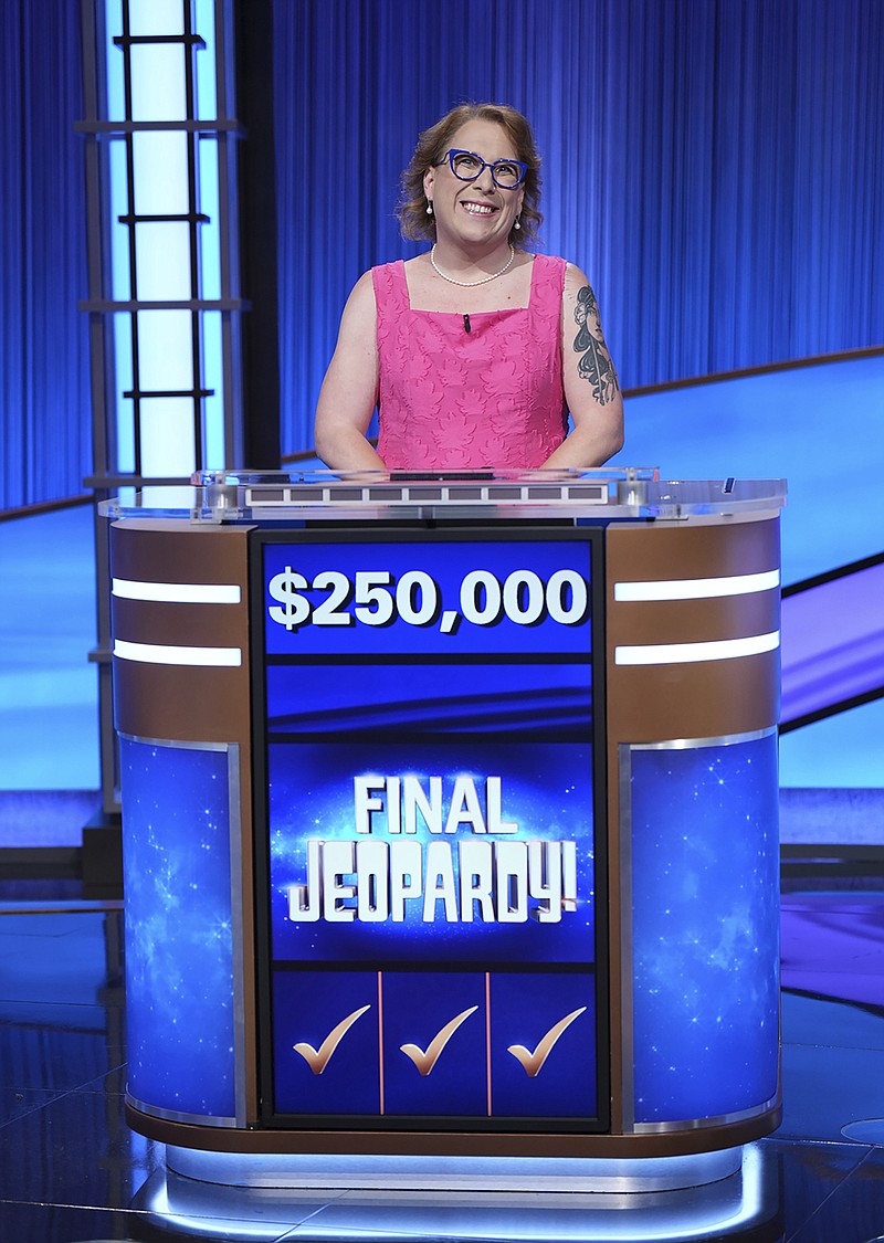 In this undated photo provided by Jeopardy Productions, Inc., "Jeopardy!" contestant Amy Schneider poses for a picture. Schneider capped her big year by winning a hard-fought “Jeopardy!” tournament of champions in an episode that aired Monday, Nov. 21, 2022. (Tyler Golden/Sony Pictures Television/Courtesy of Jeopardy Productions, Inc. via AP)