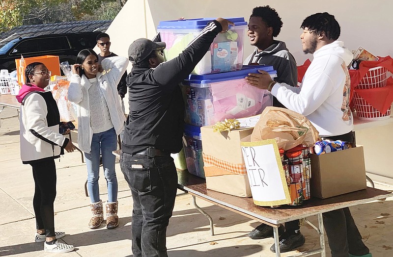 University of Arkansas at Pine Bluff students distributed donations including frozen turkeys, hams, non-perishable items, and fresh produce to community agencies. (Special to The Commercial/University of Arkansas at Pine Bluff)