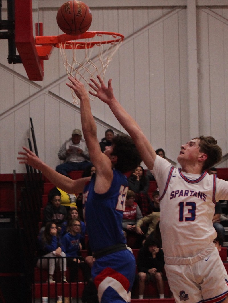 Sophomore Hayden Kilmer drives and hits a reverse layup over the Moberly defender. Kilmer had 14 points on 7-10 shooting off the bench in California's 68-63 win over Moberly. (Democrat photo/Evan Holmes)