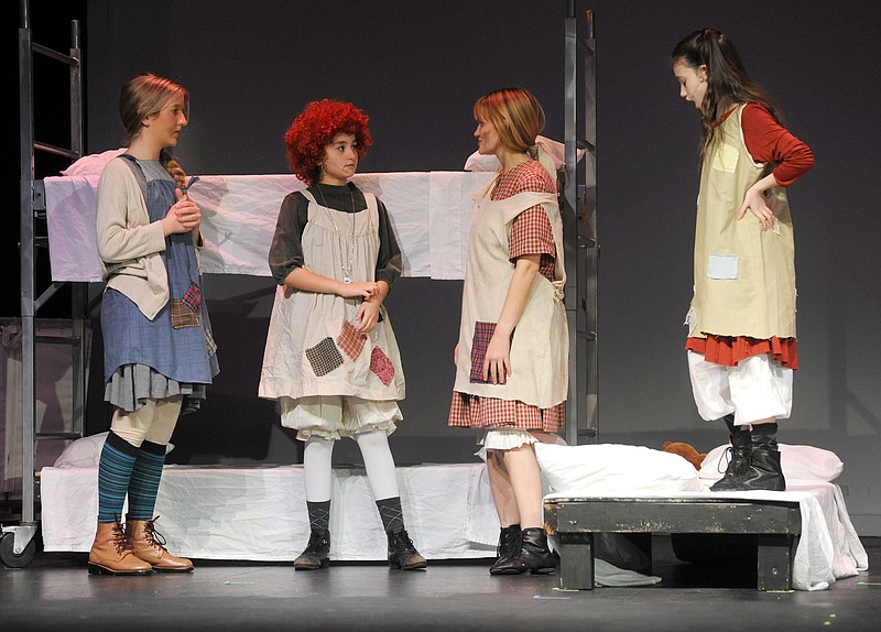 Cast members of the Capital City Productions rehearse their presentation of Annie, The Musical. (Shaun Zimmerman / News Tribune photo)