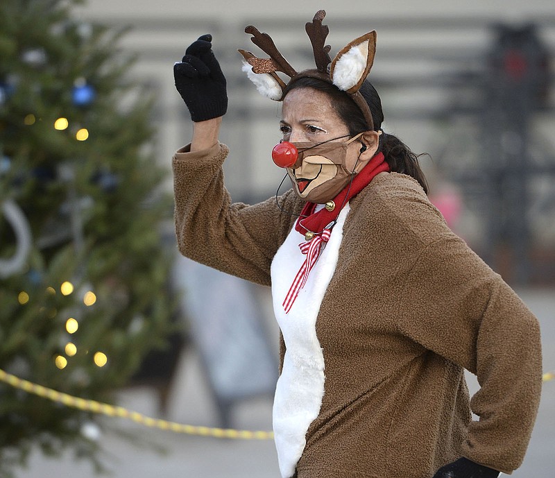 Dancing Vicki dances Nov. 27, 2021 in a Rudolph the Red-Nosed Reindeer costume as she ushers children to see Santa Claus during the Christmas on the Creek celebration in downtown Springdale. The event will take a different this year because of construction on Emma Street. Go to nwaonline.com/221124Daily/ for today's photo gallery.
(File Photo/NWA Democrat-Gazette/Andy Shupe)