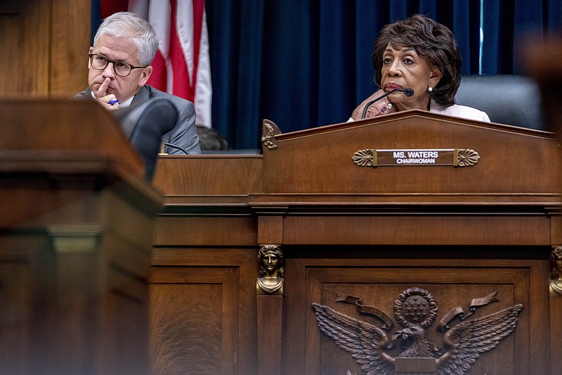 FILE - Chairwoman Maxine Waters, D-Calif., right, and Ranking Member Patrick McHenry, R-N.C., left, listen to testimony from banking leaders as they appear before a House Committee on Financial Services Committee hearing on Capitol Hill in Washington, Sept. 21, 2022. Lawmakers plan to investigate the failure of FTX, the large crypto exchange that collapsed last week and filed for bankruptcy protection, leaving investors and customers staring at losses that could total in the billions of dollars. (AP Photo/Andrew Harnik, File)