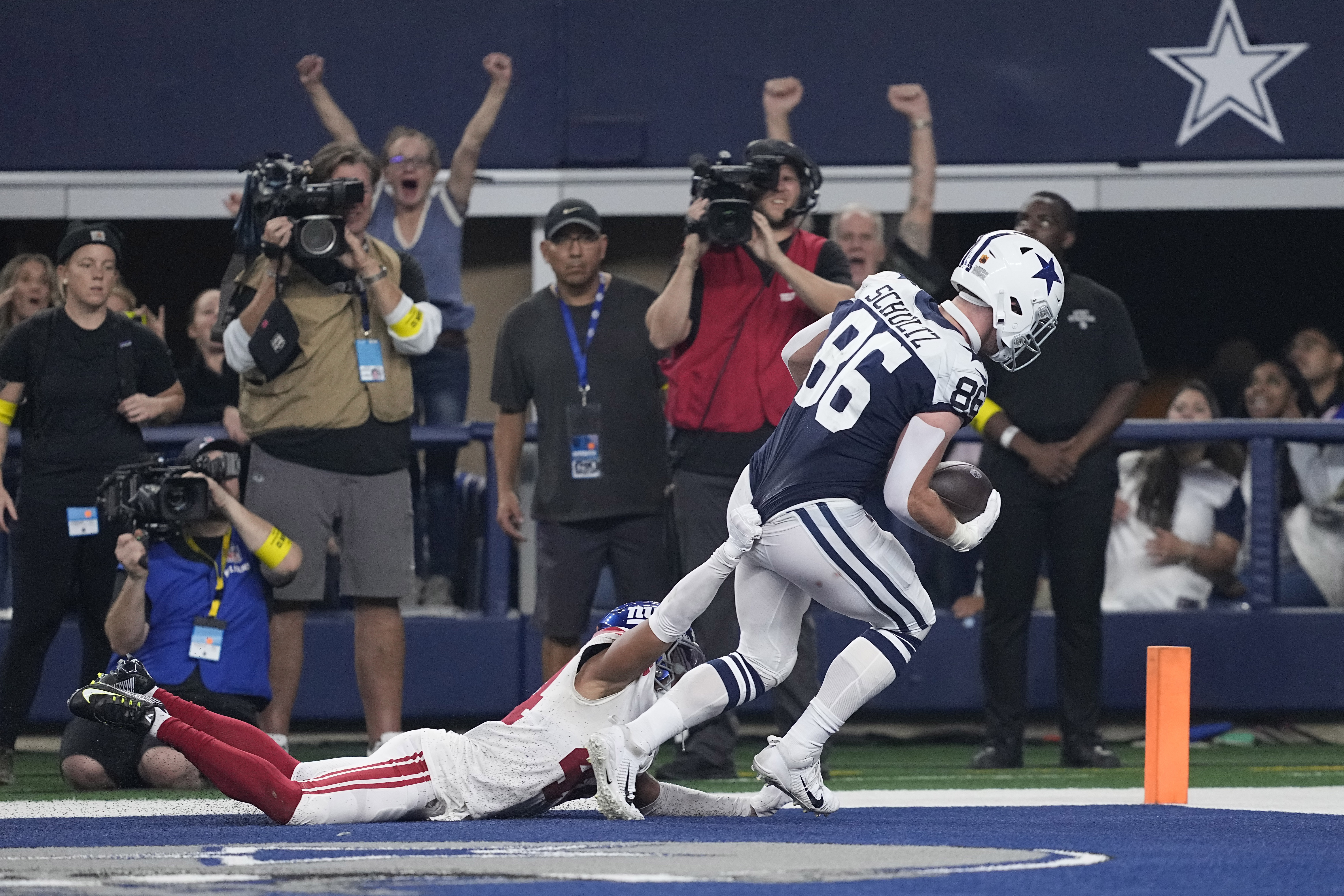 Dallas Cowboys' Dak Prescott (4) and CeeDee Lamb (88) celebrate after Lamb's  touchdown catch in the first half of an NFL football game against the  Atlanta Falcons in Arlington, Texas, Sunday, Nov.