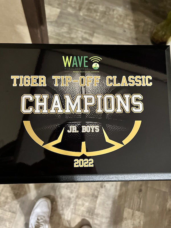 This is an example of the sports plaques that Joshua Brown and his wife have created with their sports merchandise business in Mansfield.

(Special to River Valley Democrat-Gazette/Kevin Taylor)