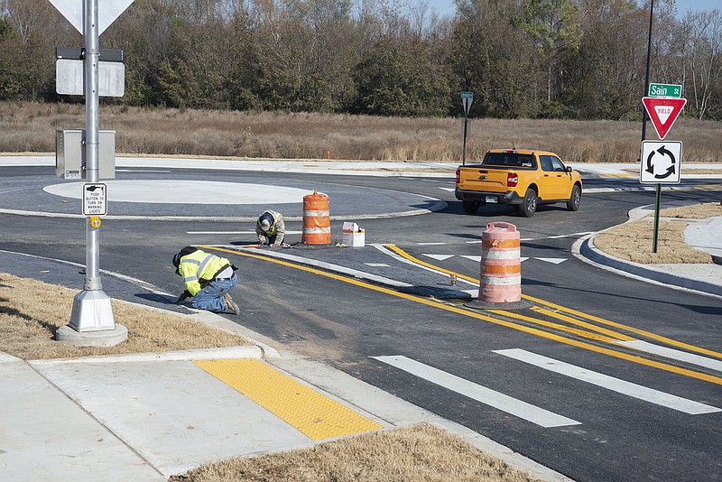 Traffic moves through the roundabout Tuesday at the Sain Street and Hemlock Avenue intersection in Fayetteville. The city has completed extending Sain Street northeast to Vantage Drive and plans to make a connection between Sain Street and Millsap Road, along with overhauling the intersection of Millsap Road and College Avenue. Visit nwaonline.com/221127Daily/ for today’s photo gallery.

(NWA Democrat-Gazette/J.T. Wampler)