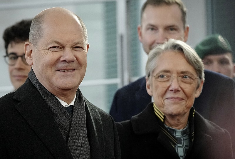 German Chancellor Olaf Scholz receives Élisabeth Borne, Prime Minister of France, with military honors in front of the Federal Chancellery in Berlin, Germany, Friday, Nov. 25, 2022.  (Kay Nietfeld/dpa via AP)