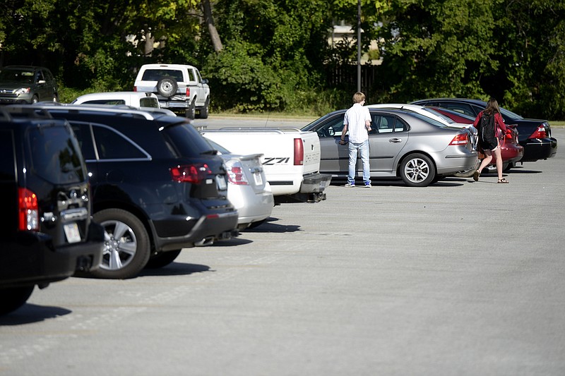 Students at Springdale High School go to their cars Sept. 25, 2013. 
(File Photo/NWA Democrat-Gazette/Anthony Reyes)