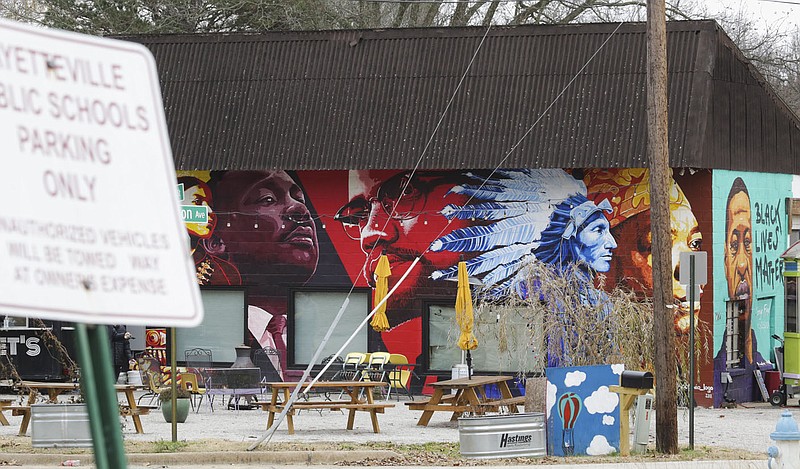 A mural is shown, Saturday, November 26, 2022 across from the former Jefferson Elementary School building in Fayetteville. The history of the Black community is disappearing, and those who want to preserve it fear the sale of Jefferson Elementary could be the final, fatal blow. Visit nwaonline.com/221127Daily/ for today's photo gallery.

(NWA Democrat-Gazette/Charlie Kaijo)