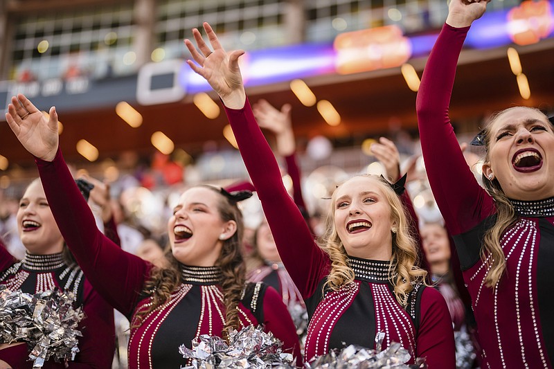 South Carolina cheer members celebrate after defeating Clemson 31-30 in an NCAA college football game on Saturday, Nov. 26, 2022, in Clemson, S.C. (AP Photo/Jacob Kupferman)