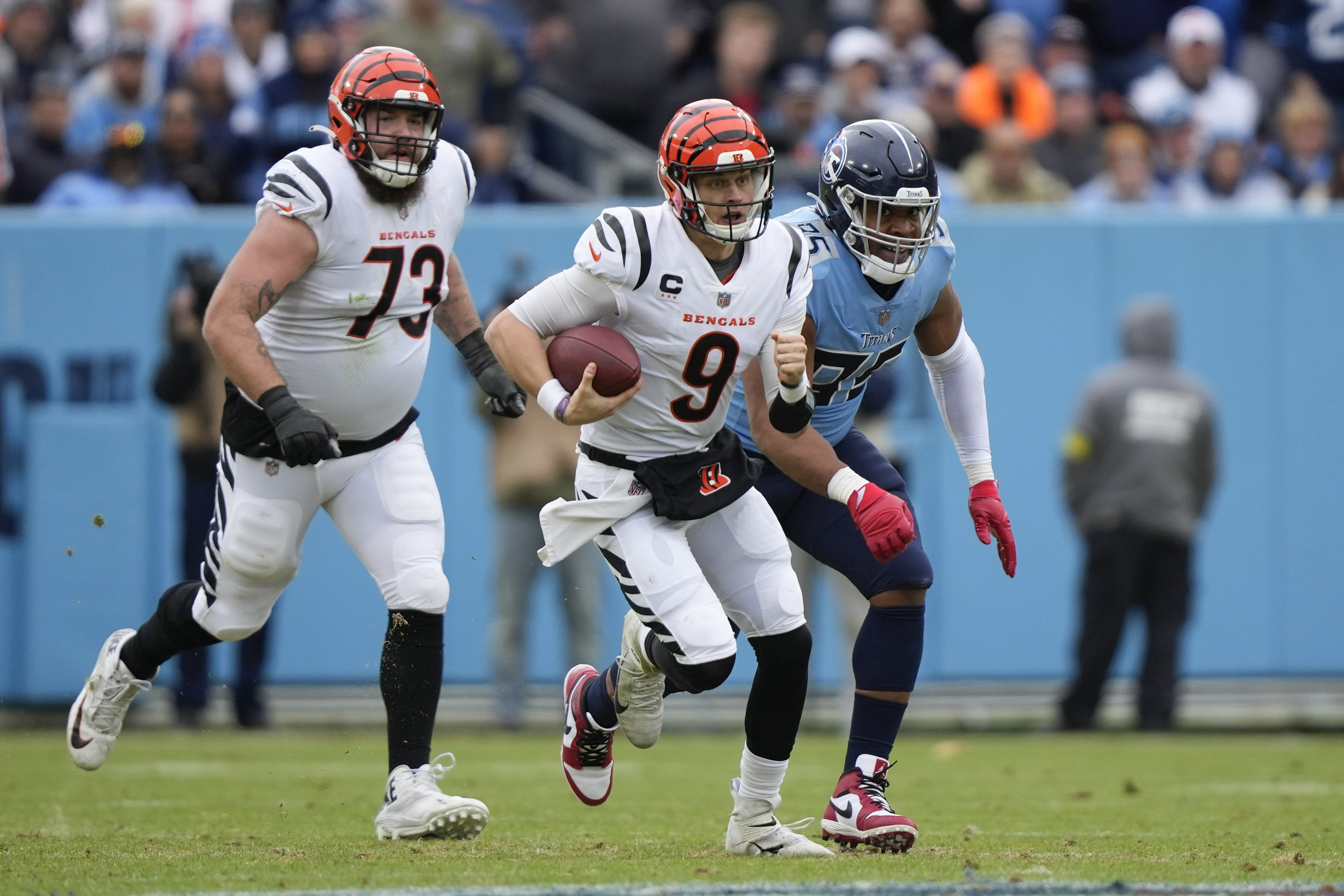 Cincinnati Bengals quarterback Joe Burrow (9) walks to the sidelines during  an NFL football gam …