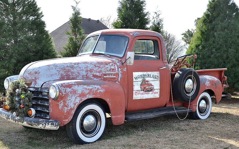 A red 1953 Chevrolet 3100 pickup truck is available for family photos at Wonderland Christmas Tree Farm.

(NWA Democrat-Gazette/Annette Beard)