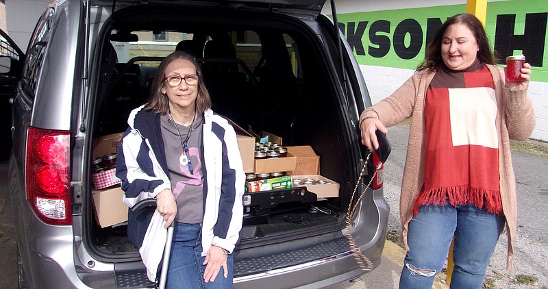 Sharon Parrett, left, club president, is shown with Tammy Jones of Jackson House. - Submitted photo