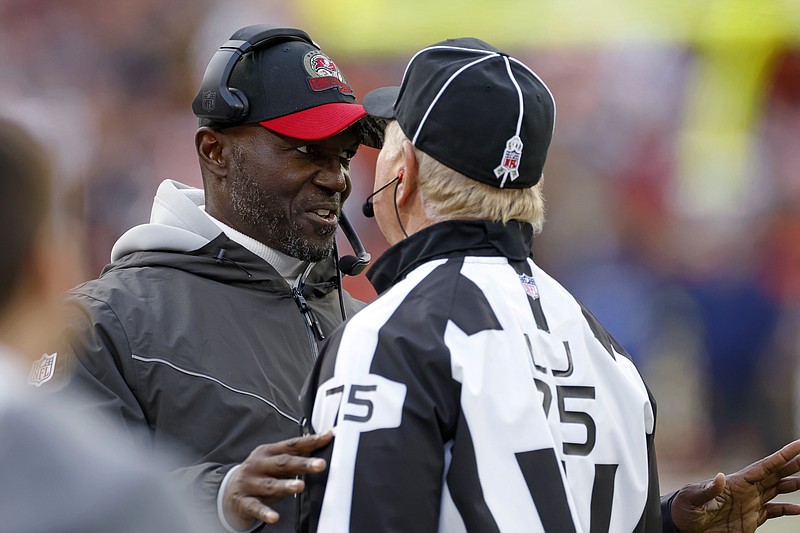 Tampa Bay Buccaneers coach Todd Bowles, left, talks with line judge Mark Stewart during the second half of the team's NFL football game against the Cleveland Browns in Cleveland, Sunday. - Photo by Ron Schwane of The Associated Press