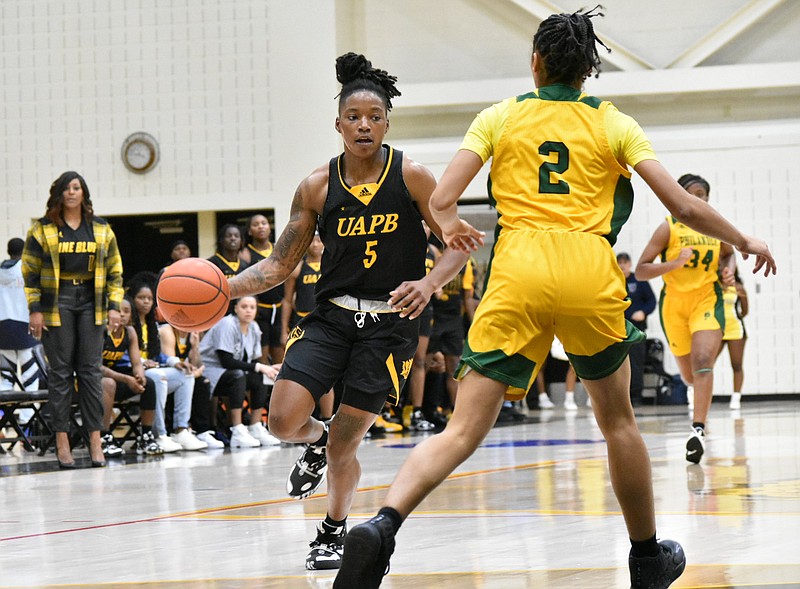 Jelissa Reese of UAPB pushes the ball against Philander Smith College in a Nov. 15 game. (Pine Bluff Commercial/I.C. Murrell)