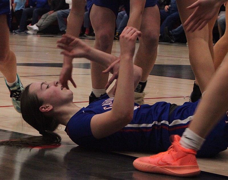 Junior forward Lauren Friedrich hits the ground after hitting a basket, plus a foul against Tipton on Friday night. Friedrich had 29 points and seven rebounds in the Tipton Tournament championship game. (Democrat photo/Evan Holmes)