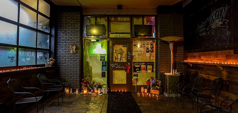 Julie Smith/News Tribune photo:
Tributes to Skylar Smock poured in following his death, as the makeshift memorial to him grew in the south entryway to J.Pfenny's Grill and Pub, where Smock was an employee. He was shot and killed early Saturday morning, Nov. 26, 2022, while trying to break up an altercation between two patrons.