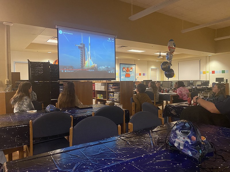 During a Texas Middle School celebration Tuesday, Nov. 29, 2022, in Texarkana, Texas, audience members watch the Mission 16 rocket launch. Three TMS students were recognized for their scientific experiment going to the International Space Station. (Staff photo by Andrew Bell)