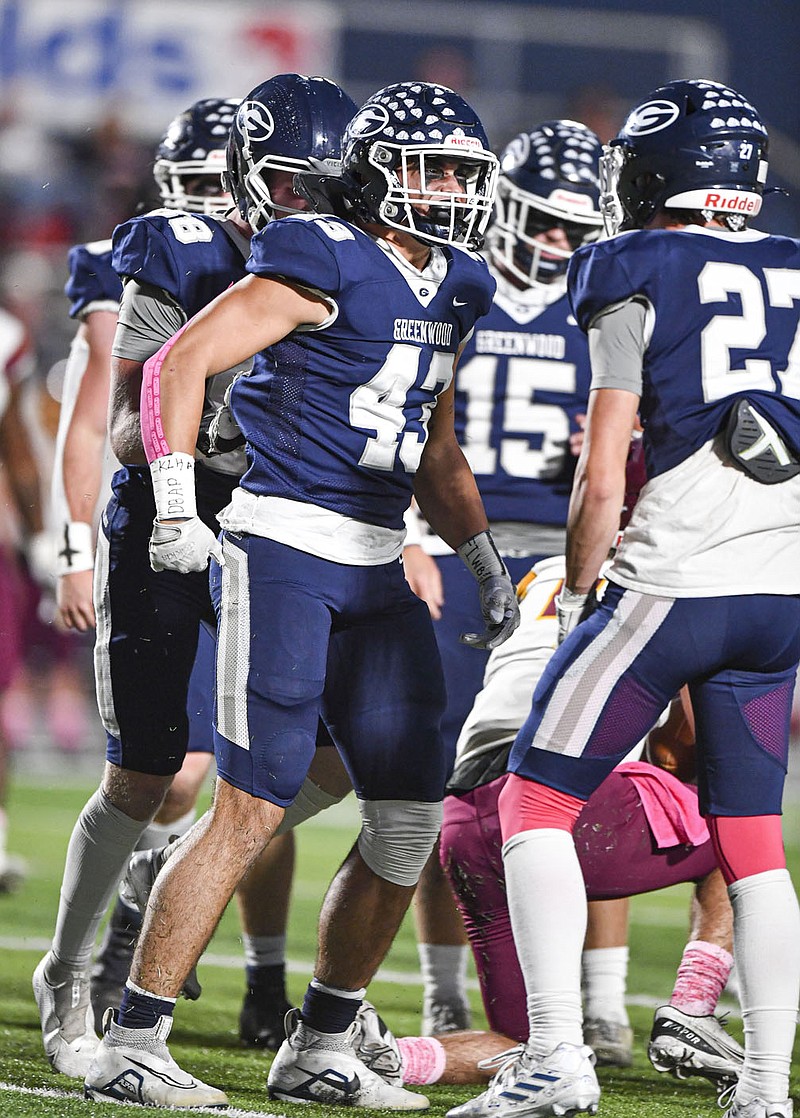 Greenwood linebacker Evan Williams (43) celebrates with teammates after making a tackle, Friday, Oct. 14, 2022, during the first quarter of the Bulldogs' 24-0 win over Lake Hamilton at Smith-Robinson Stadium in Greenwood. Williams and the Bulldogs will take on Pulaski Academy at 6 p.m. today in the Class 6A state championship game at War Memorial Stadium in Little Rock.
(NWA Democrat-Gazette/Hank Layton)