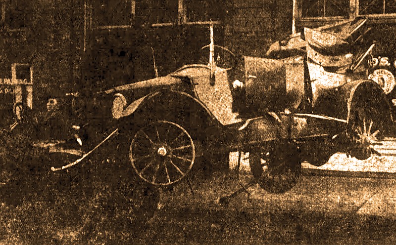 The ruin that was Mrs. Ed Pruss' Essex touring car dangles from the boom hook and chain of a Lynn Bros. wrecker in this photo from the Nov. 29, 1922, Arkansas Gazette. (Democrat-Gazette archives)