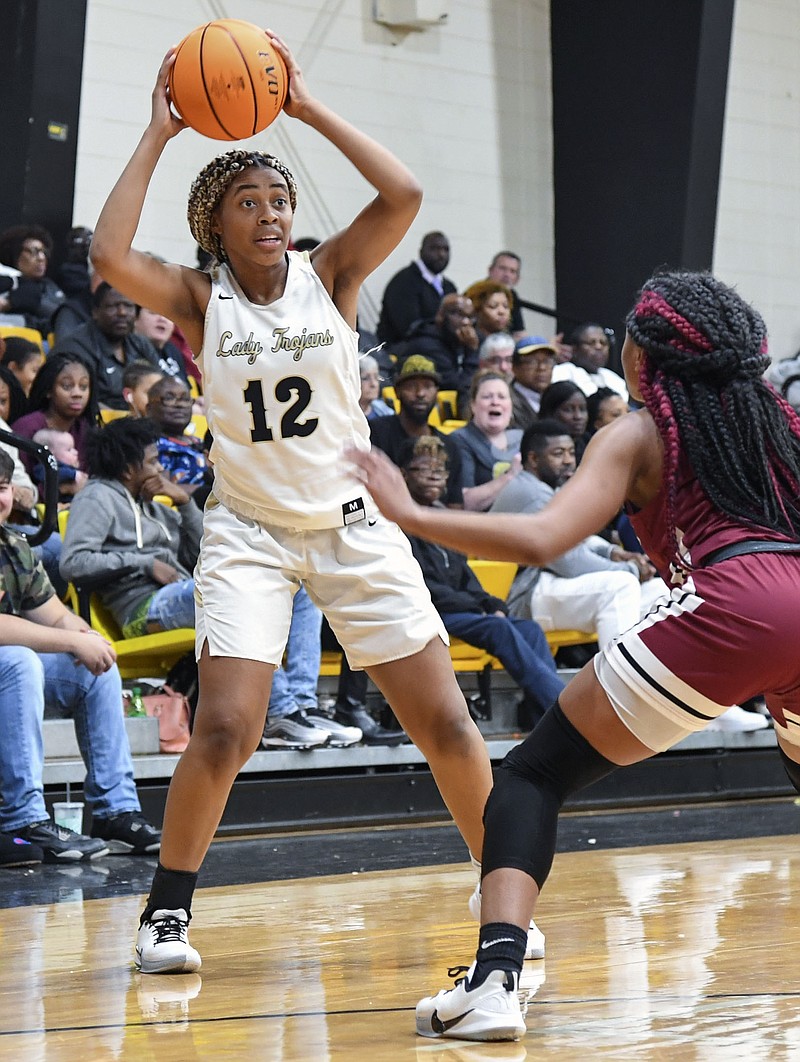 In a file photo from 2020, Hot Springs junior forward KaLariya McDaniel (12) looks to pass as Texarkana junior guard Staijah Taylor defends at Trojan Fieldhouse. - File photo by The Sentinel-Record
