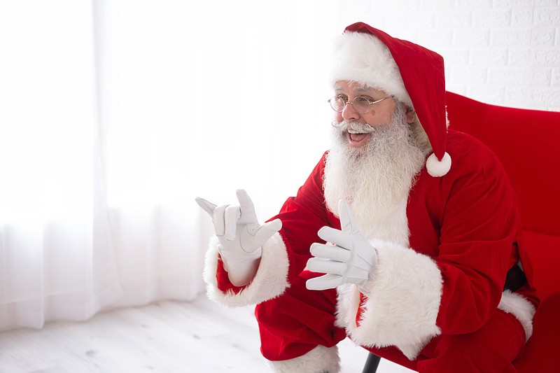 This photo shows Charles Graves dressed as Santa Claus in Austin, Texas on on Sept. 3, 2022. Graves is a rare Deaf Santa in his first year donning the red suit as a professional. (Michael J. Samaripa via AP)