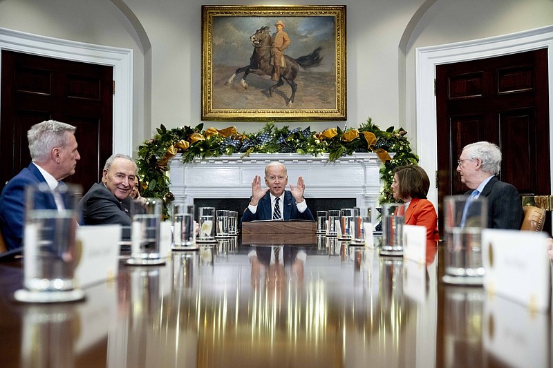 CORRECTS YEAR TO 2022  -  President Joe Biden, center, at the top of a meeting with congressional leaders to discuss legislative priorities for the rest of the year, Tuesday, Nov. 29, 2022, in the Roosevelt Room of the White House in Washington. From left are House Minority Leader Kevin McCarthy of Calif., Senate Majority Leader Chuck Schumer, of N.Y.,  Biden, House Speaker Nancy Pelosi of Calif., and Senate Minority Leader Mitch McConnell of Ky. (AP Photo/Andrew Harnik)