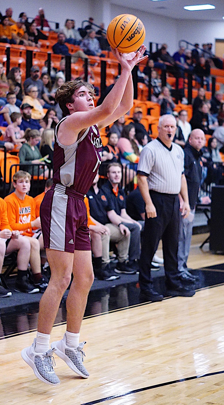 RANDY MOLL  EAGLE-OBSERVER/Lincoln hit a number of key 3-point shots, including this one by Bryson Karber, during a 68-63 double overtime loss at Gravette on Thursday, Dec. 1, 2022.