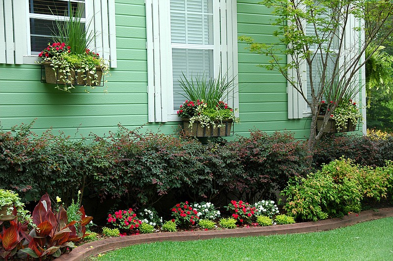 Repeating window box plantings is similar to adding repetition in the landscape. (TNS/Norman Winter)