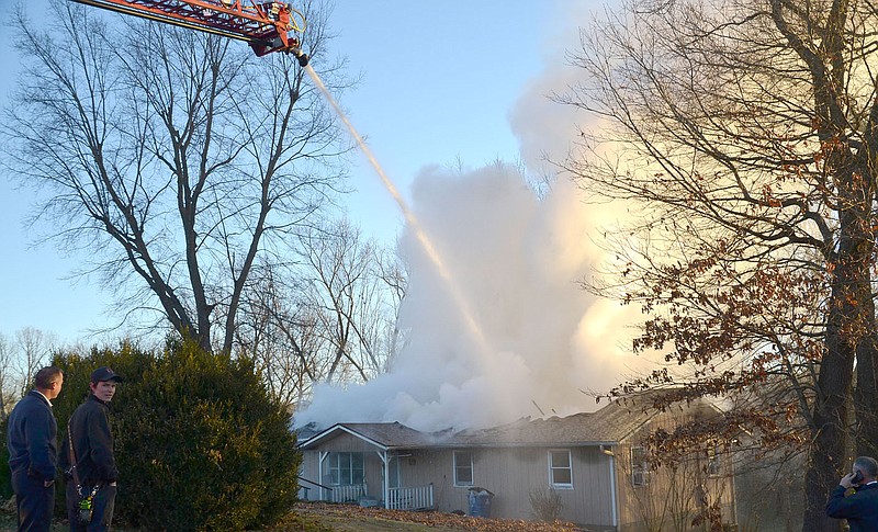 TIMES photograph by Annette Beard
Pea Ridge Fire Department was assisted by firefighters from Little Flock, Avoca, NEBCO and Rogers in fighting the blaze that destroyed a house on Clark Street just after dawn Wednesday, Nov. 30, 2022. For more photographs, go to the PRT gallery at https://tnebc.nwaonline.com/photos/.