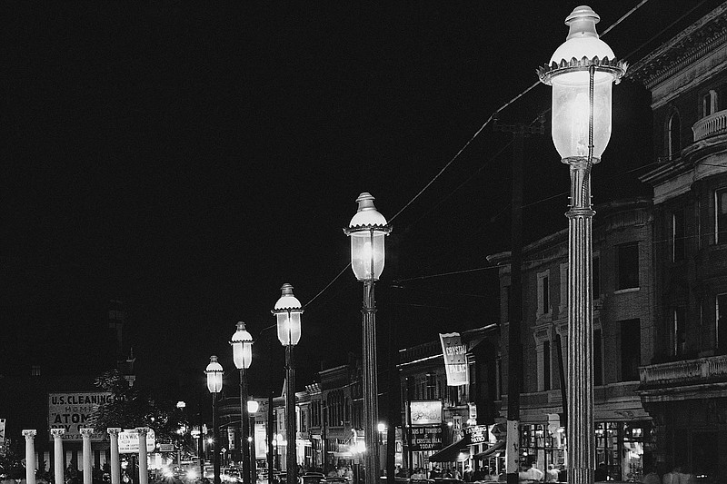 Gas lamps illuminate St. Louis' Gaslight Square on April 2, 1962. "Gaslighting" — behavior that’s mind manipulating, grossly misleading, downright deceitful — is Merriam-Webster's word of 2022. (File Photo/AP/JMH)