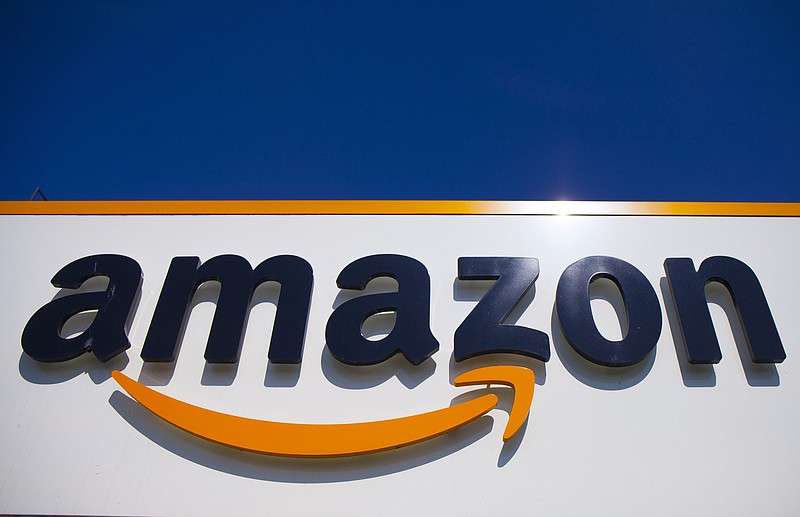 FILE - The Amazon logo is seen in Douai, northern France, April 16, 2020. Amazon said Wednesday, Nov. 30, 2022, that it had its biggest Thanksgiving holiday shopping weekend, aided by a record number of consumers looking for deals online amid high inflation. (AP Photo/Michel Spingler, File)