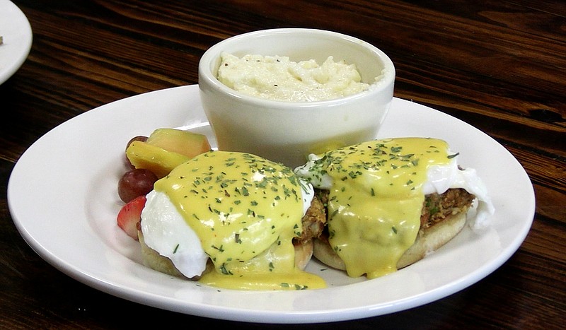 The crab cake eggs Benedict with grits is shown at Poached. - Photo by Lance Porter of The Sentinel-Record
