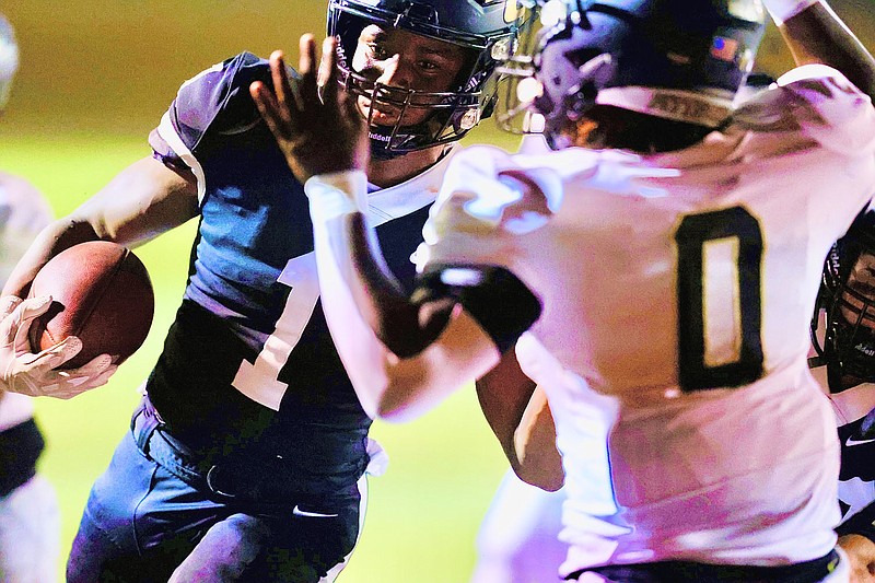 Pleasant Grove's Kaden McFadden runs the ball against Pittsburg at Hawk Stadium in Texarkana, Texas. (Photo by JD for the Texarkana Gazette)